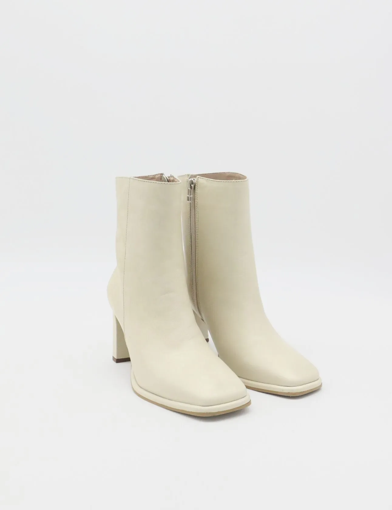 Indigo heeled ankle boots in off white leather womens shoes