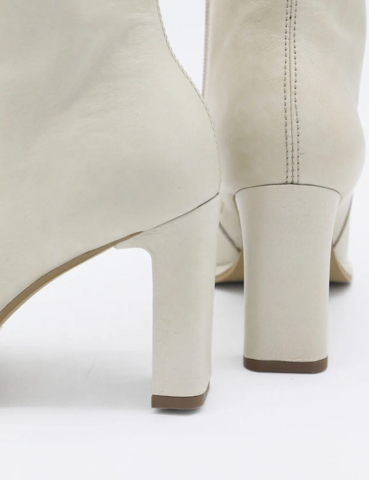 Indigo heeled ankle boots in off white leather womens shoes